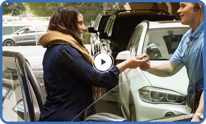 A Signature Parking team member welcoming an arriving guest.